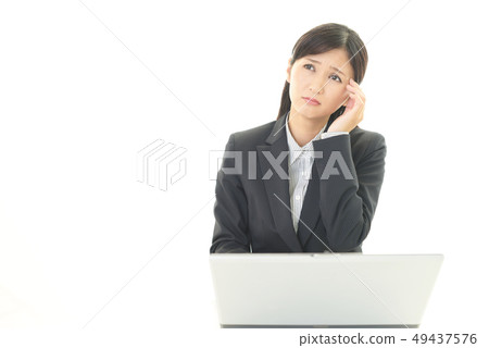 Tired business looking woman 49437576