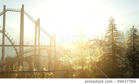 old roller coaster at sunset in forest old roller coaster at sunset in forest 49437769