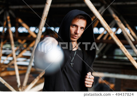 Aggressive man beats the bat. Stylish guy  Aggressive man beats the bat. Stylish guy  49437824