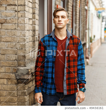 Handsome stylish man in fashionable checked shirt 49438161