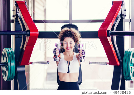 sporty woman doing exercises sporty woman doing exercises 49438436