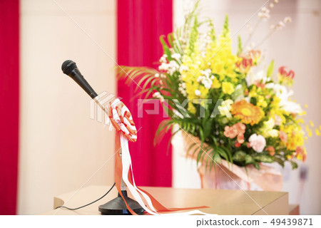 Graduation ceremony venue (Pedestal microphone with flowers on the floor) Graduation ceremony venue (Pedestal microphone with flowers on the floor) 49439871