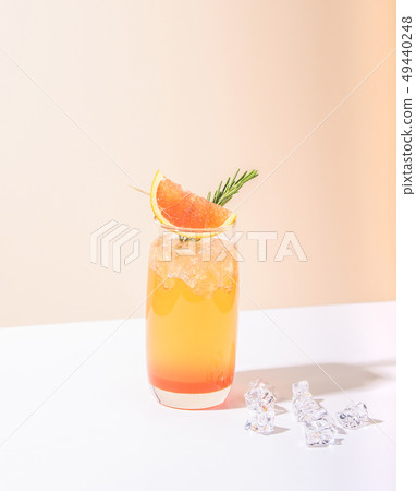 Cold and refreshing orange punch cocktail Cold and refreshing orange punch cocktail 49440248