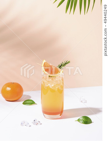 Cold and refreshing orange punch cocktail  49440249