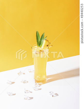 iced pineapple punch cocktail in glass iced pineapple punch cocktail in glass 49440253