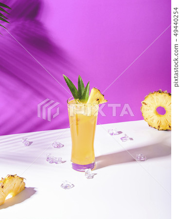 iced pineapple punch cocktail in glass iced pineapple punch cocktail in glass 49440254