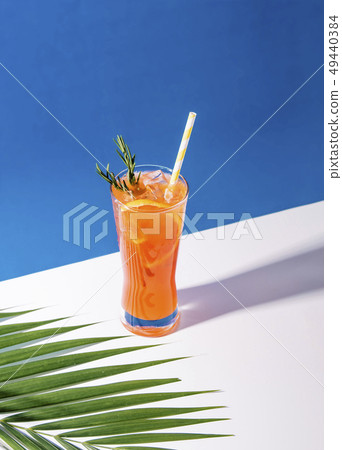 Cold and refreshing orange punch cocktail  49440384
