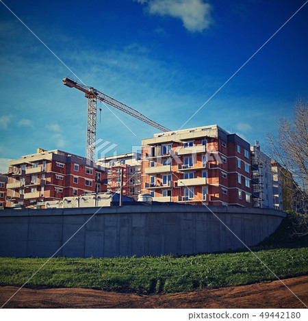 Crane and construction of new buildings.  49442180