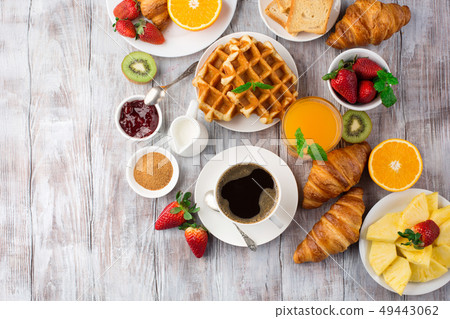 Continental breakfast table with coffee, orange Continental breakfast table with coffee, orange 49443062