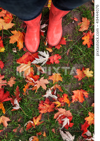 Legs in rubber boots on a background of 49444076