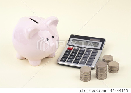 Piggy bank and coin and calculator 49444193