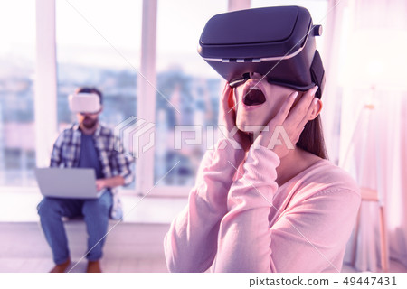 Shocked female person putting hands on her cheeks 49447431