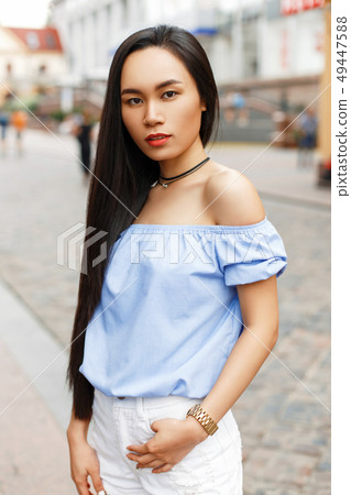 Beautiful Asian woman walking in the city 49447588
