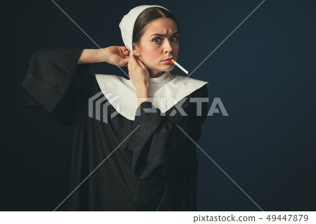 Medieval young woman as a nun 49447879