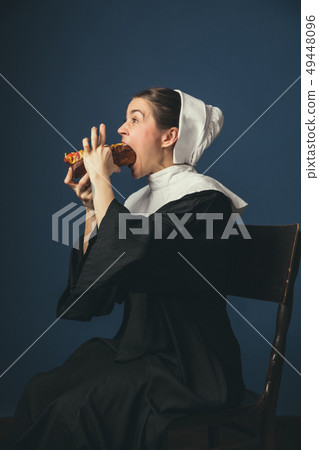 Medieval young woman as a nun 49448096