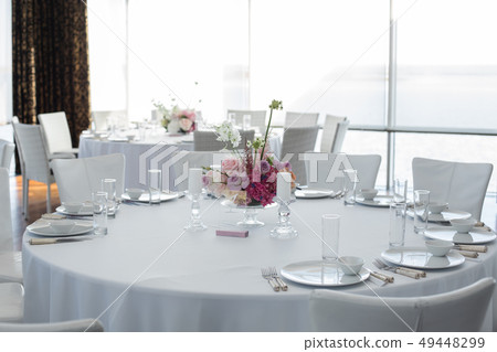 Event white restaurant table served and decorated 49448299