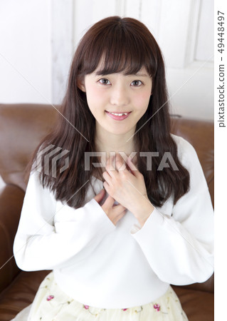 Young lady's hair style 49448497