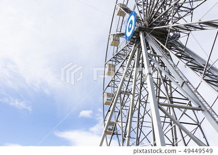Ferris wheel joy sky clouds amusement Park. 49449549