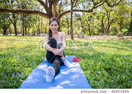 Concept of exercise. Beautiful girl stretching the Concept of exercise. Beautiful girl stretching the 49453949