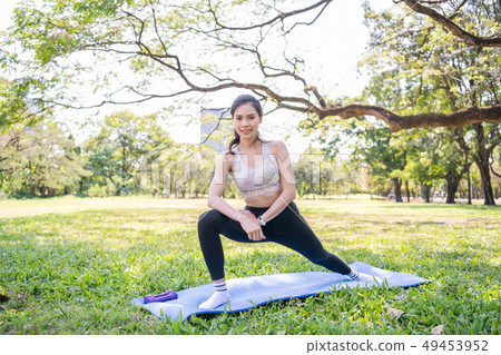 Concept of exercise. Beautiful girl stretching the Concept of exercise. Beautiful girl stretching the 49453952
