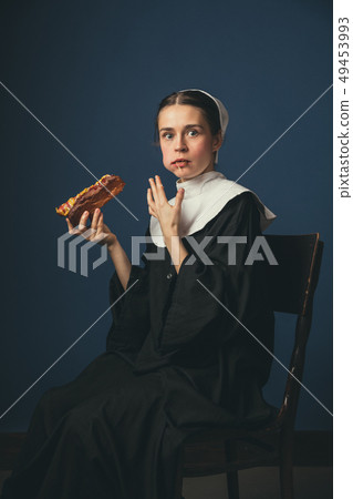 Medieval young woman as a nun 49453993