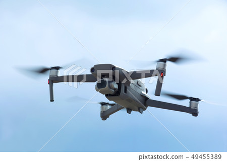 Drone quadcopter with digital camera in the sky Drone quadcopter with digital camera in the sky 49455389