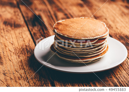 Stack of american pancakes on white plate 49455883