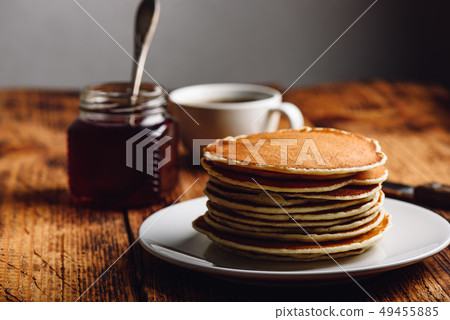 Stack of pancakes on white plate 49455885