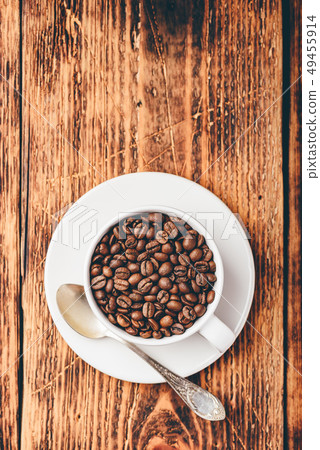 Roasted coffee beans in cup Roasted coffee beans in cup 49455914