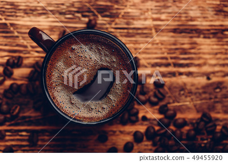 Brewed black coffee in metal mug Brewed black coffee in metal mug 49455920