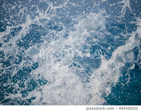 Splashes of water against the sea 49456020