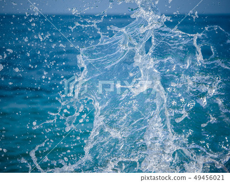 Splashes of water against the sea Splashes of water against the sea 49456021
