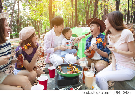 happy young friends group enjoying picnic party happy young friends group enjoying picnic party 49460483