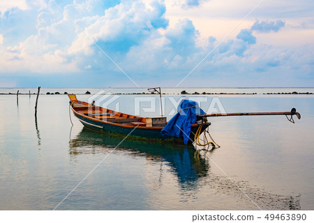 Fishing boat in the sea, sunset and silhouettes of 49463890
