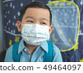 Little boy wearing protective mask protection from 49464097