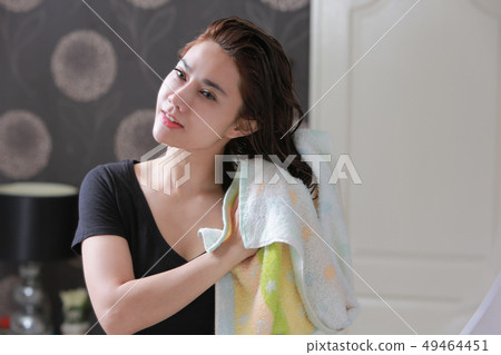 Pretty woman wiping her hair with bath towel. 49464451