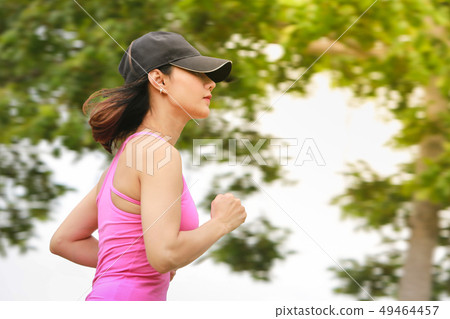 Young fitness woman running in the park. 49464457