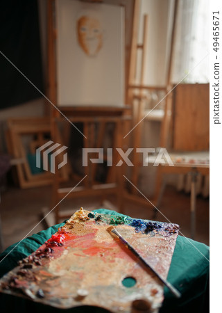 Color palette and brush, easel on background Color palette and brush, easel on background 49465671