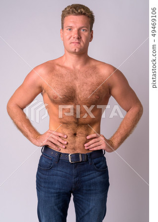 Portrait of young blonde man shirtless with chest hair Portrait of young blonde man shirtless with chest hair 49469106