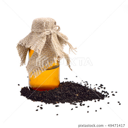 Nigella oil with seeds. 49471417