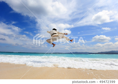 Men training on a beautiful tropical country beach Men training on a beautiful tropical country beach 49472399
