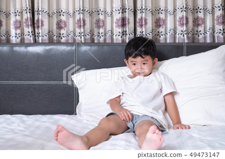 3 years old little cute Asian boy at home on the 49473147