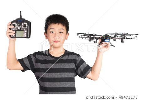 Asian boy holding drone and radio remote control 49473173