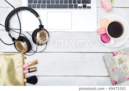 Female workplace with headphones Female workplace with headphones 49473381