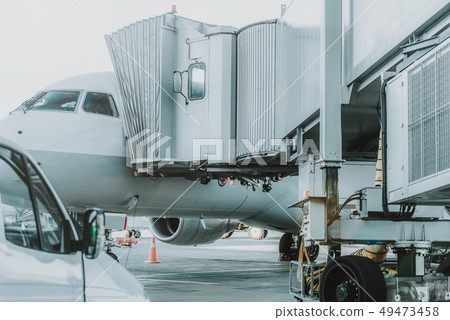 Huge white airplane standing on the airfield Huge white airplane standing on the airfield 49473458