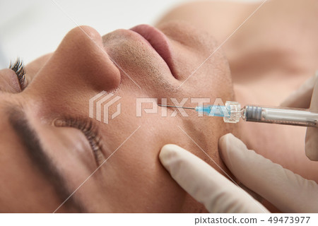 Close up young man on rejuvenate procedure 49473977