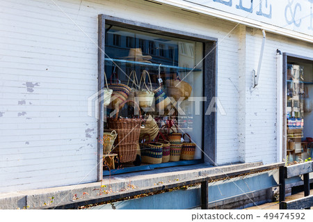Woven bags with pruce in the shop window. Handmade 49474592