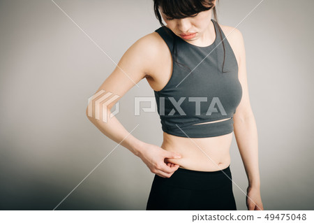 Young Japanese woman who eats stomach belly Diet image Young Japanese woman who eats stomach belly Diet image 49475048