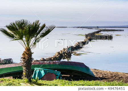 Old fishing boats with bright colors at dawn Old fishing boats with bright colors at dawn 49476451