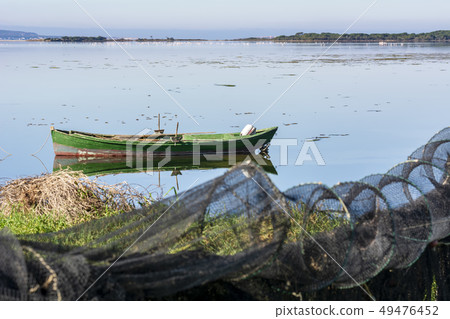 Old fishing boats with bright colors at dawn Old fishing boats with bright colors at dawn 49476452